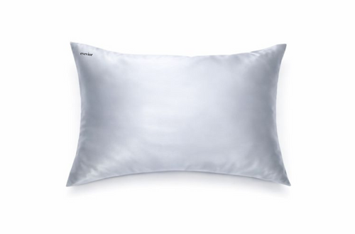 Powder blue silk pillowcase with small black embroidered logo in the top right corner.